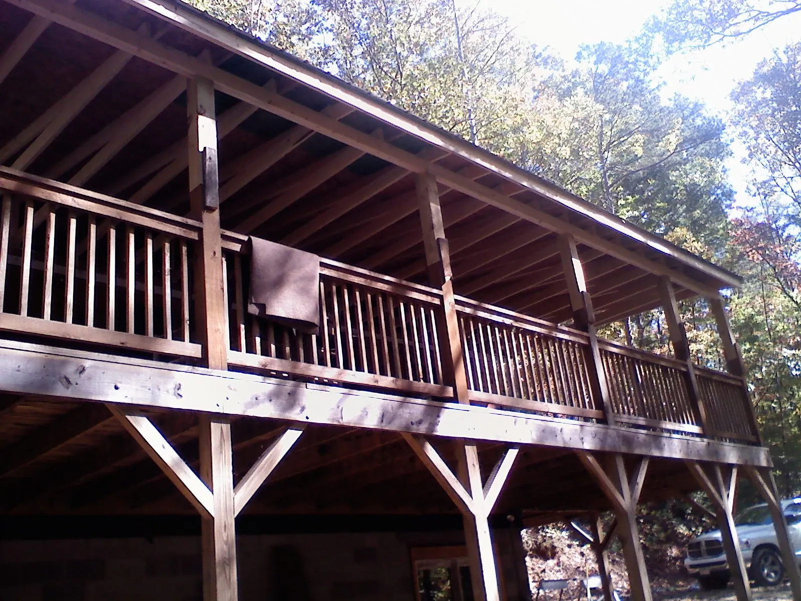 Timber framing under a new elevated porch and deck — Roof Leak Repair in Harborcreek by Roofing Brothers